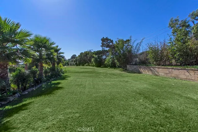 a view of a swimming pool with an outdoor seating