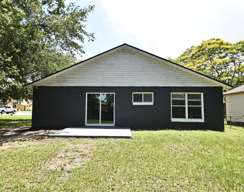 1502 West 16th Street Sanford, FL 32771 - Photo 4 of 9 a front view of house with yard and trees around