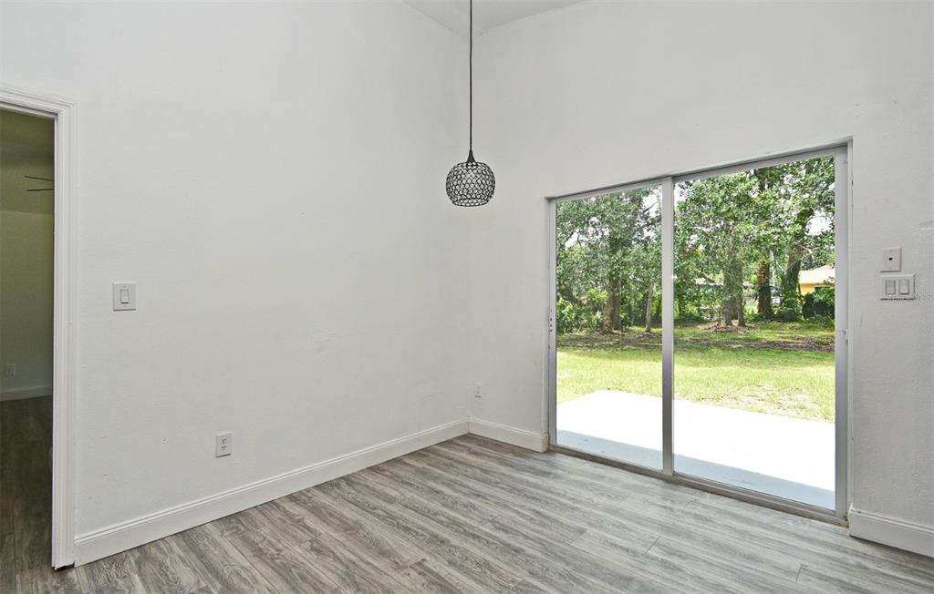1502 West 16th Street Sanford, FL 32771 - Photo 9 of 9 a view of a room with wooden floor and a window