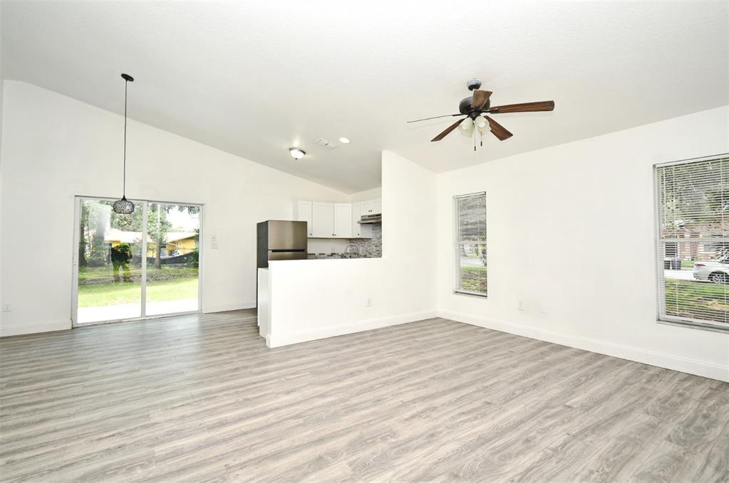1502 West 16th Street Sanford, FL 32771 - Photo 10 of 12 a view of empty room with wooden floor and fan