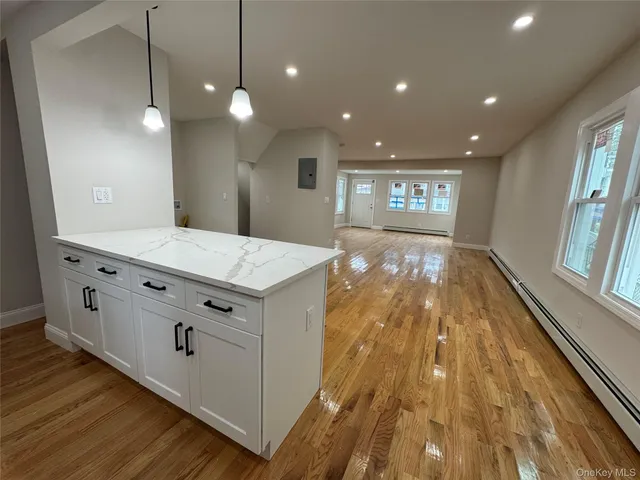 a view of a bathroom with sink and wooden floor