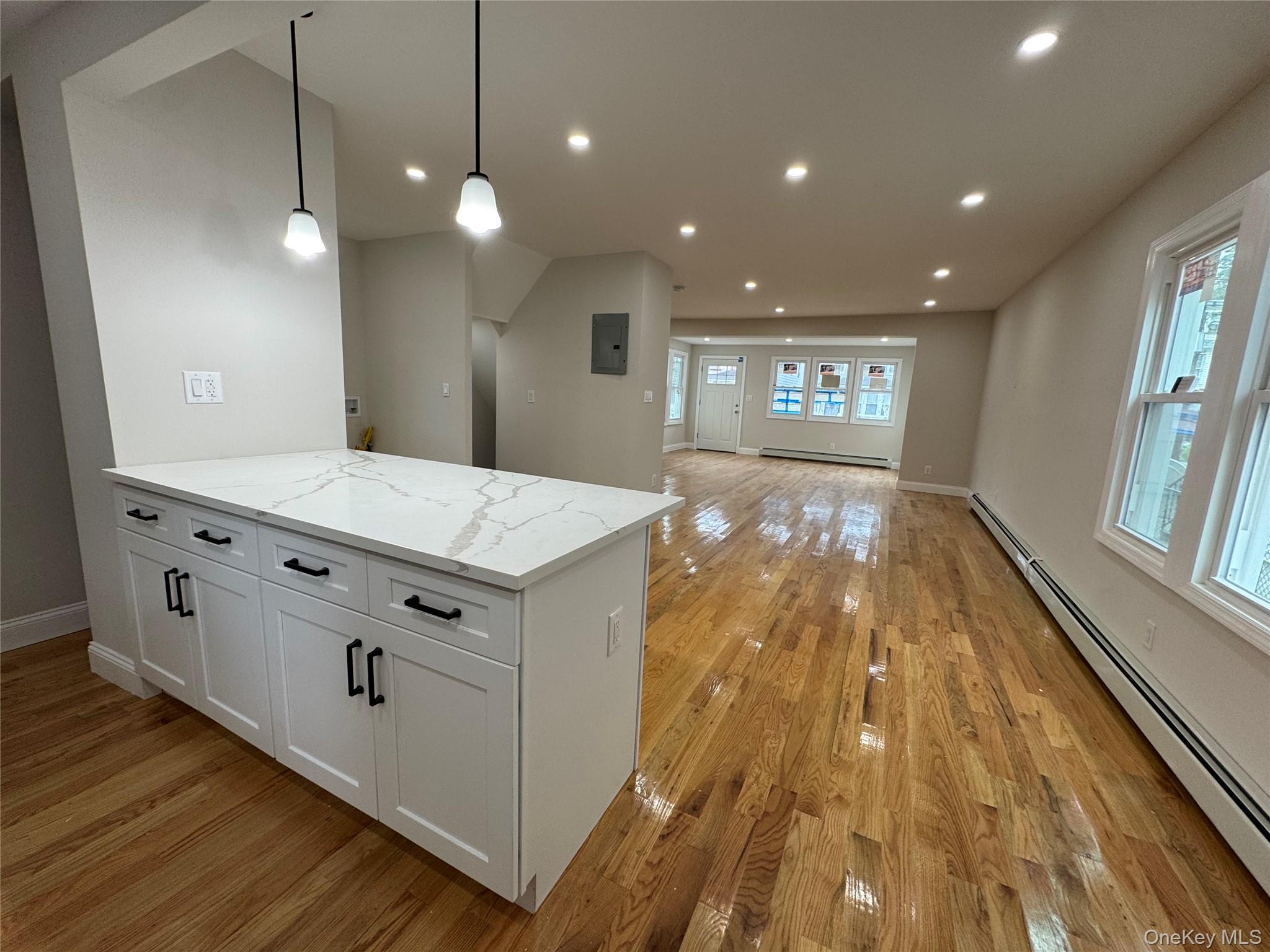 194-45 Murdock Avenue Queens, NY 11412 - Photo 5 of 23 a view of a bathroom with sink and wooden floor