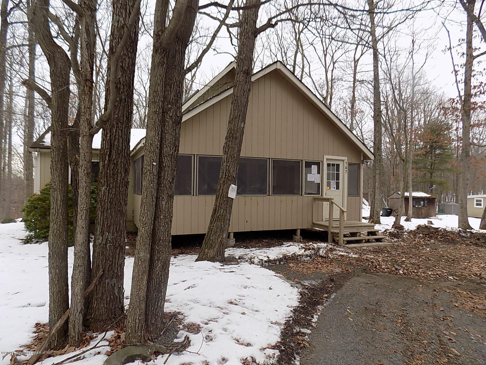 147 Yale Road Milford, PA 18337 - Photo 1 of 12 a front view of a house with a yard covered in snow