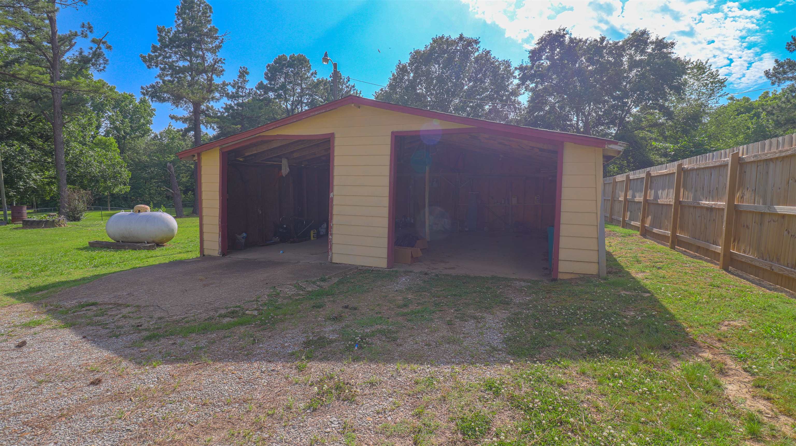 1675 Tabernacle Road Covington, TN 38019 - Photo 3 of 21 a view of a backyard with tree and wooden fence