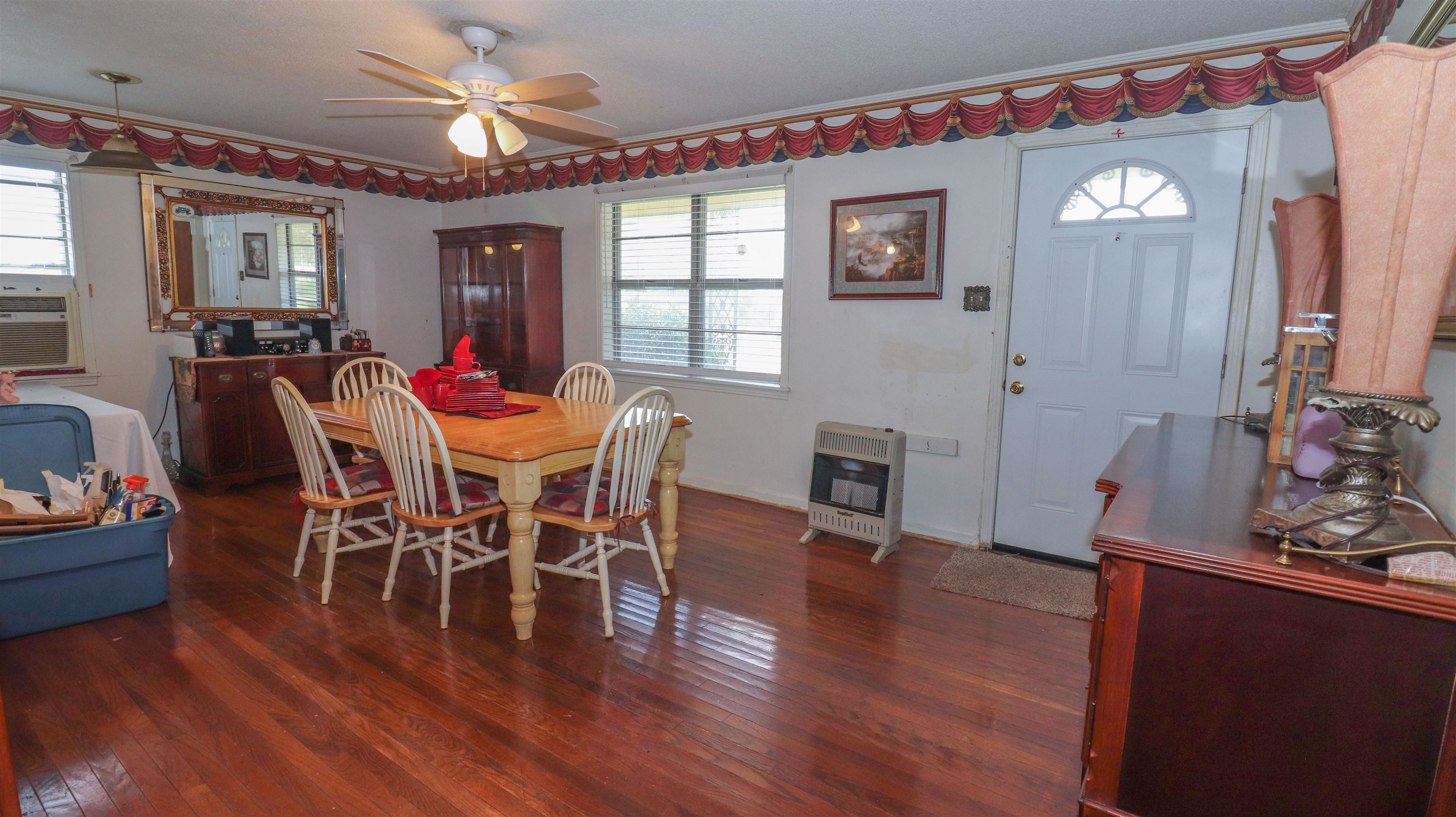 1675 Tabernacle Road Covington, TN 38019 - Photo 4 of 21 a view of a dining room with furniture and wooden floor