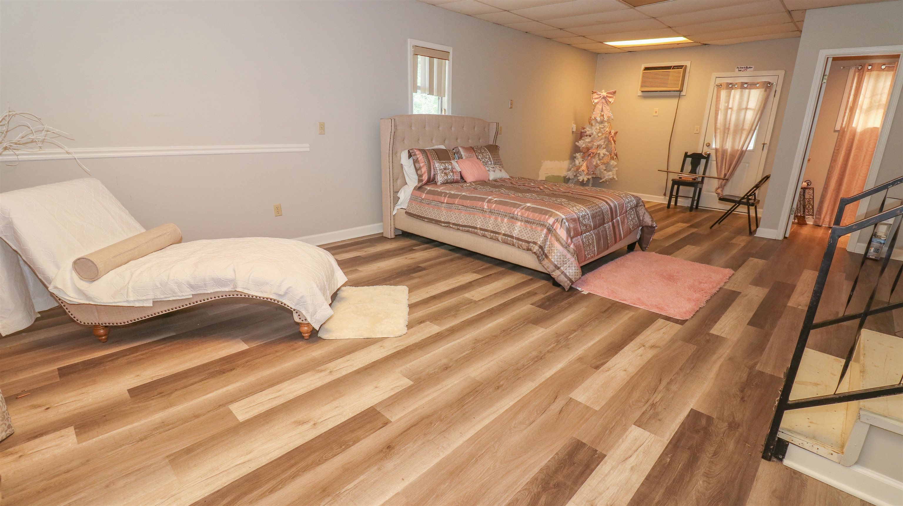 1675 Tabernacle Road Covington, TN 38019 - Photo 8 of 21 a spacious bedroom with a bed and a mirror on dresser