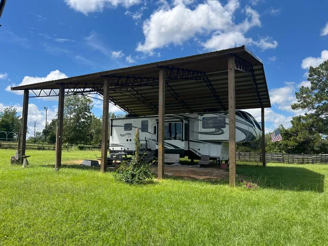 a view of a house with backyard and a hammock