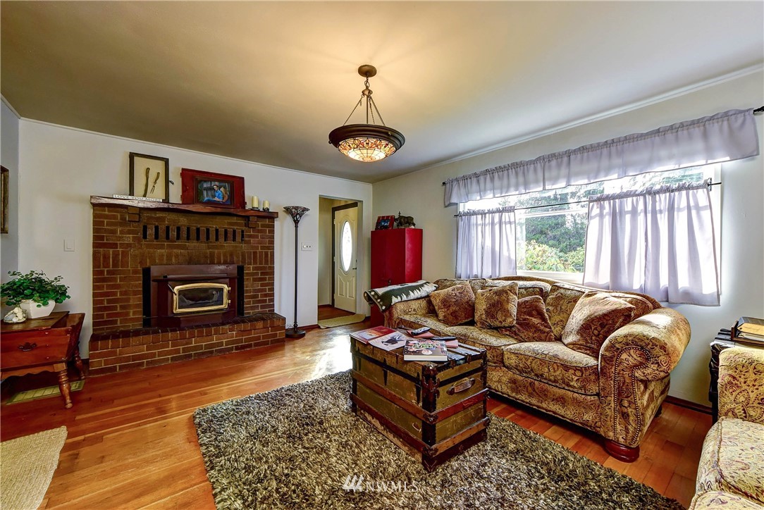 3625 Newberg Road Snohomish, WA 98290 - Photo 6 of 25 a living room with furniture a window and a fireplace