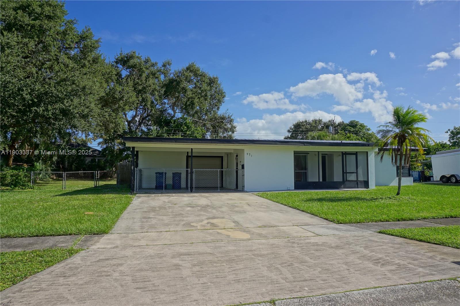 front view of a house with a yard and a garage