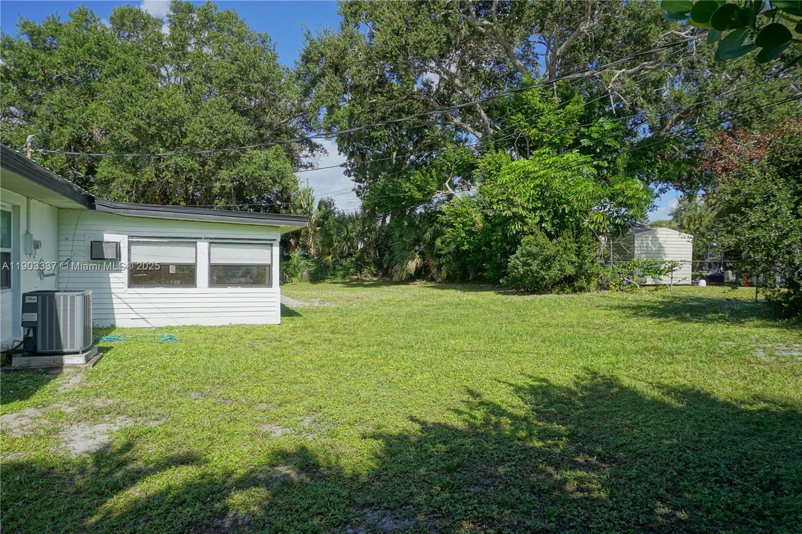 971 Fulton Lane Northeast Palm Bay, FL 32905 - Photo 11 of 29 a view of house with backyard