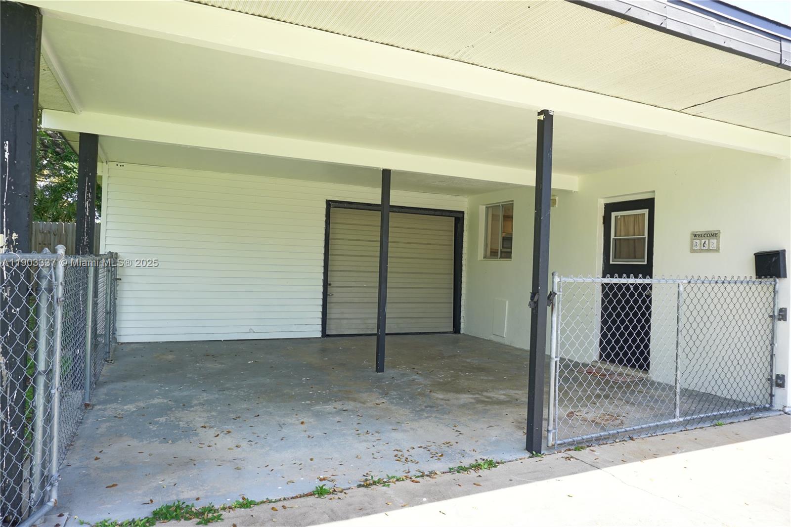 971 Fulton Lane Northeast Palm Bay, FL 32905 - Photo 15 of 29 a view of a house with a glass door
