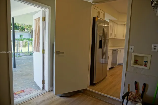 a view of two beds and a couch