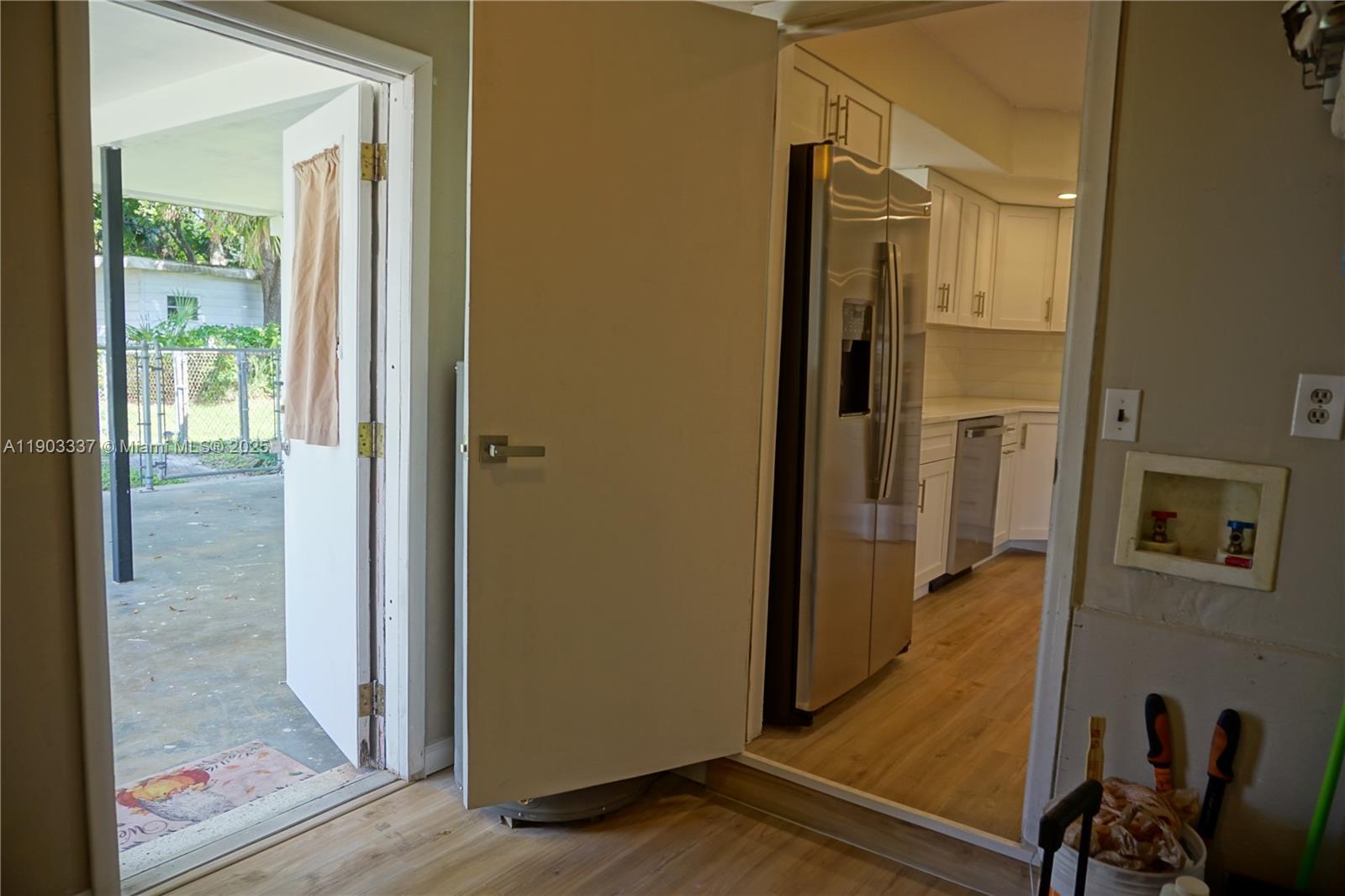 971 Fulton Lane Northeast Palm Bay, FL 32905 - Photo 28 of 29 a view of a hallway with a door and bedroom