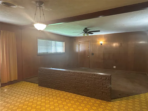 a view of an empty room and window