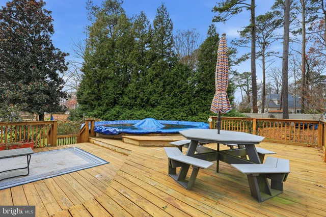 a view of outdoor sitting area with furniture and wooden floor