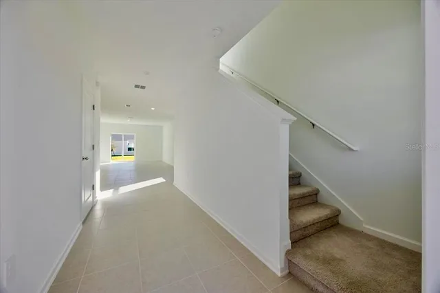 a view of a hallway with staircase