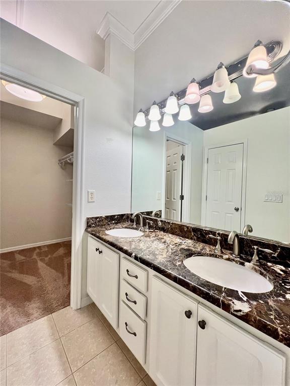2513 West Kansas Avenue, Unit B Tampa, FL 33629 - Photo 25 of 27 a bathroom with a granite countertop sink and a mirror