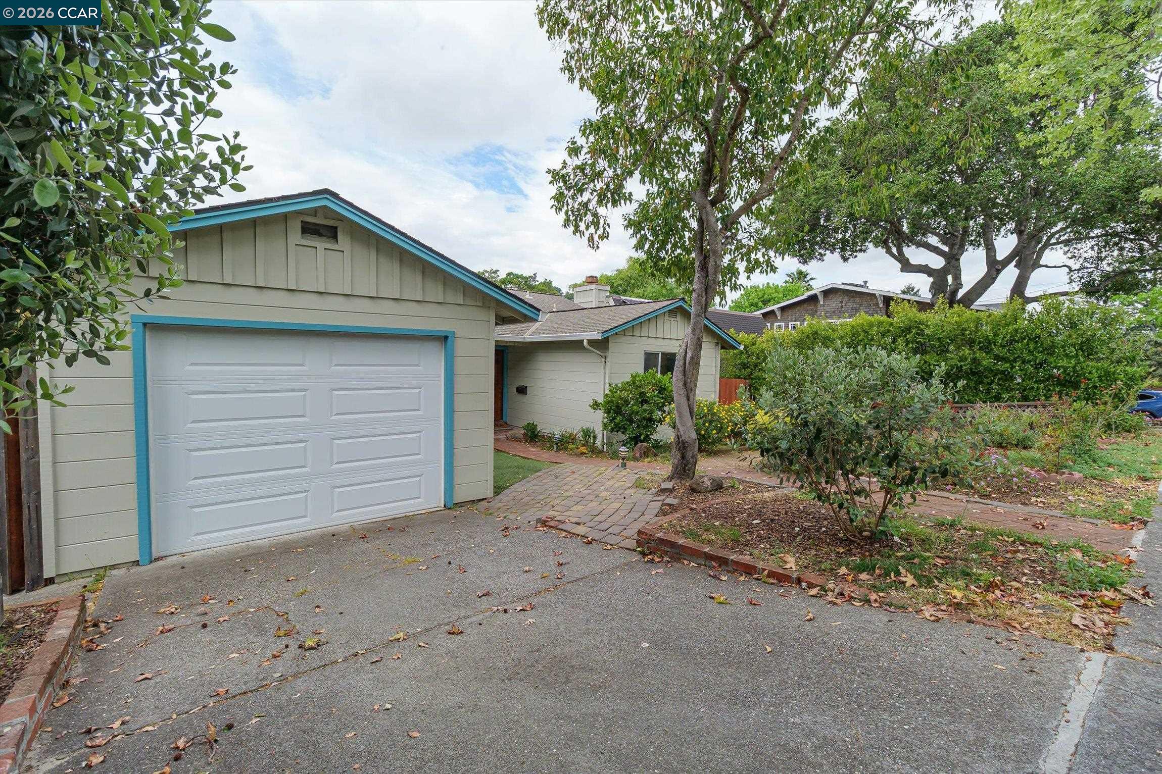 315 Forbes Avenue San Rafael, CA 94901 - Photo 3 of 28 a front view of a house with a yard and garage
