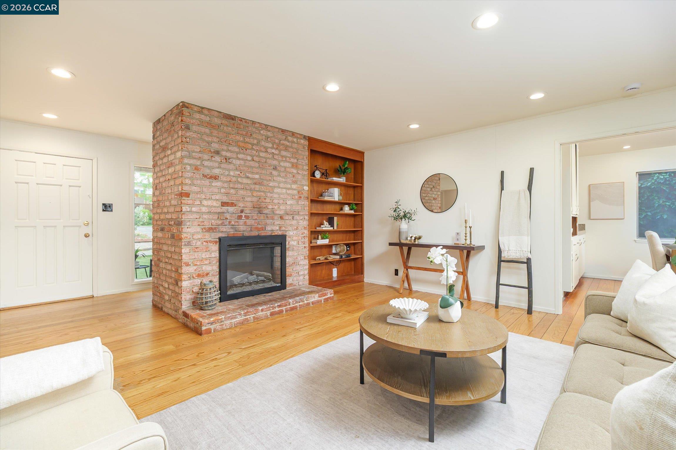 315 Forbes Avenue San Rafael, CA 94901 - Photo 7 of 28 a living room with furniture and a fireplace