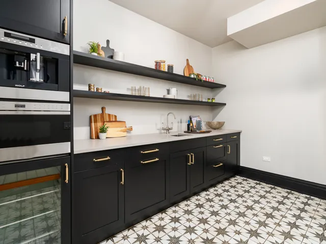 a kitchen with a stove and cabinets