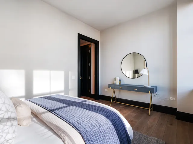 a bedroom with bed and a window