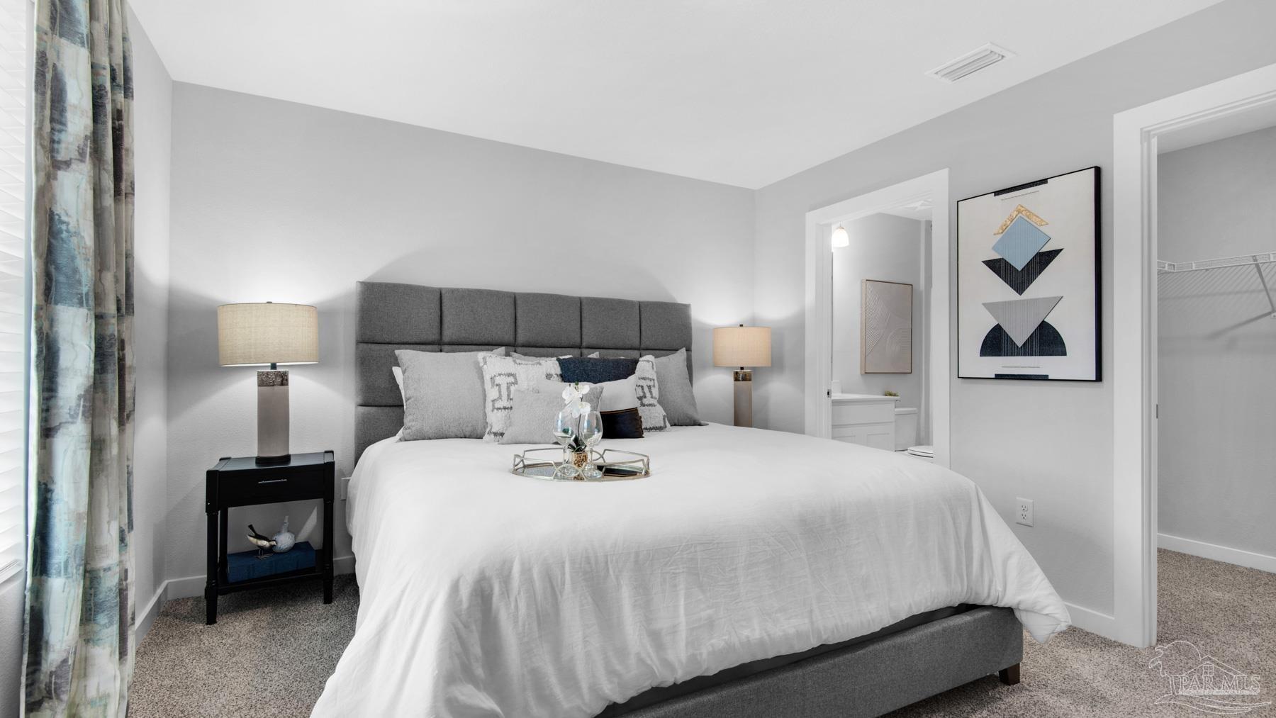 8 Spoonbill Street Cantonment, FL 32533 - Photo 17 of 38 a bedroom with a bed and lamp