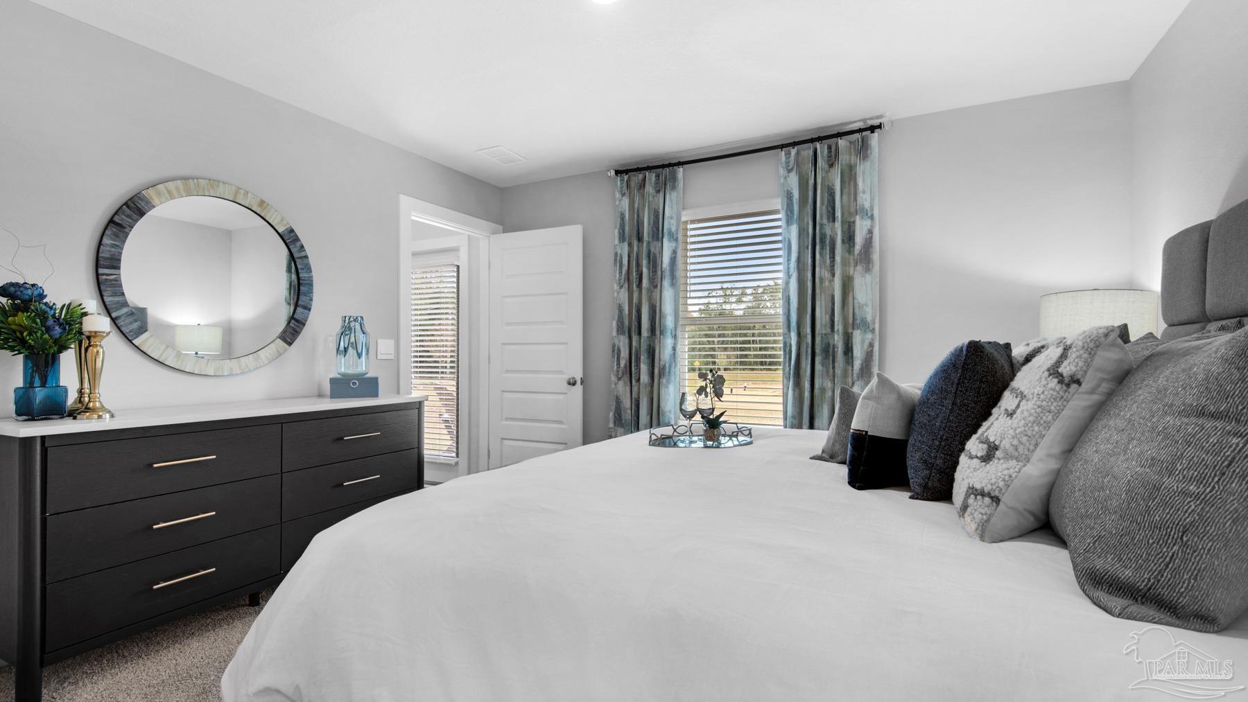 8 Spoonbill Street Cantonment, FL 32533 - Photo 19 of 38 a bedroom with a bed and a dresser