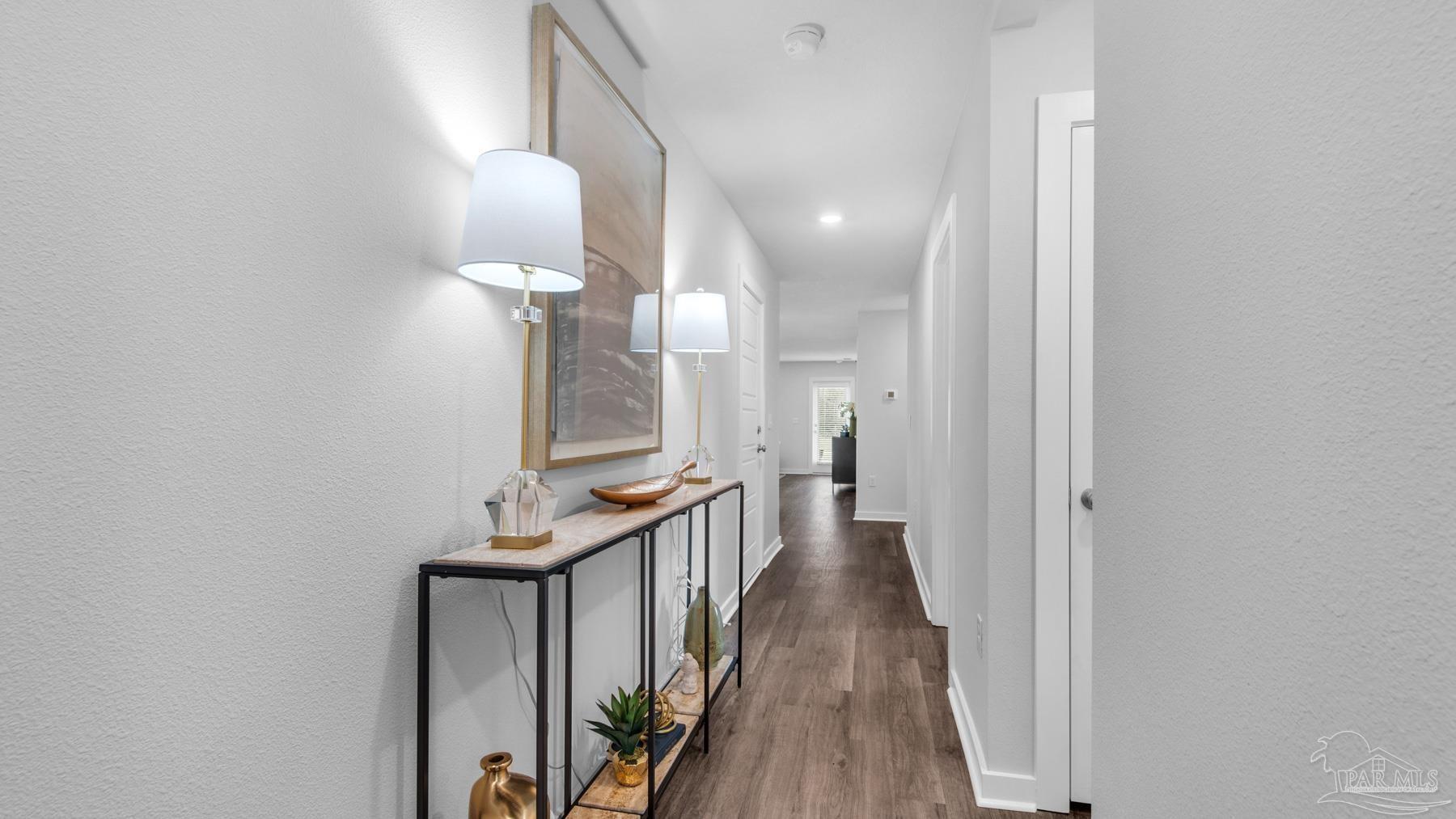 8 Spoonbill Street Cantonment, FL 32533 - Photo 4 of 38 a view of a hallway with wooden floor and staircase
