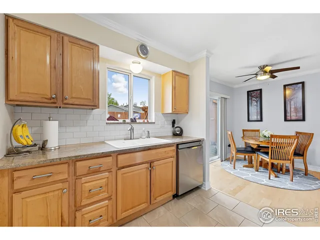 a kitchen with sink and cabinets