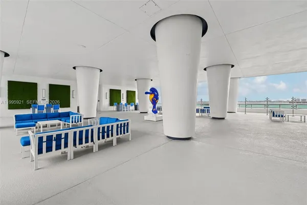 a view of a roof deck with furniture