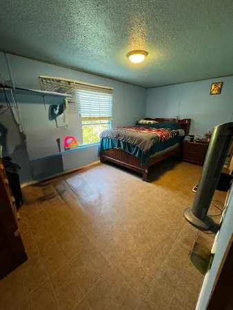 a bed room with a bed and a couch