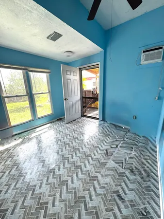 a view of an empty room and window