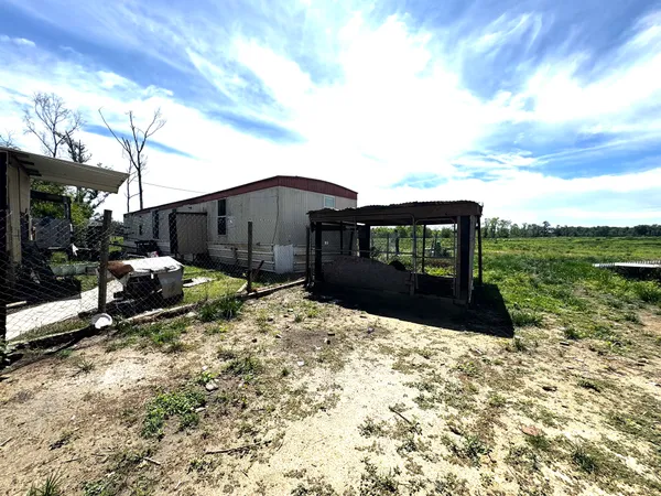 a view of a back yard of the house