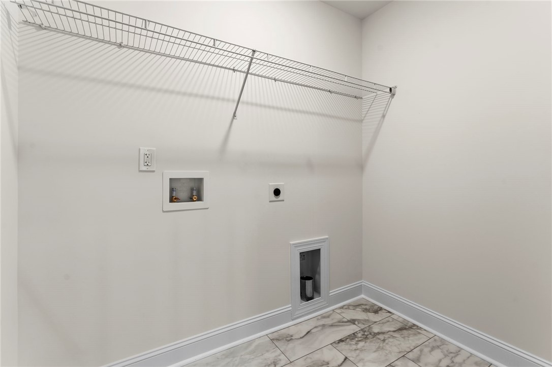 505 Fire Tower Road Williamston, SC 29697 - Photo 27 of 37 This dedicated laundry space offers practical convenience for daily chores.