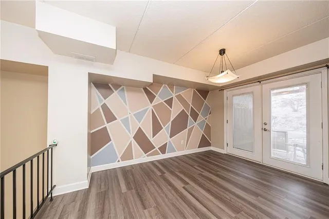 a view of entryway with wooden floor