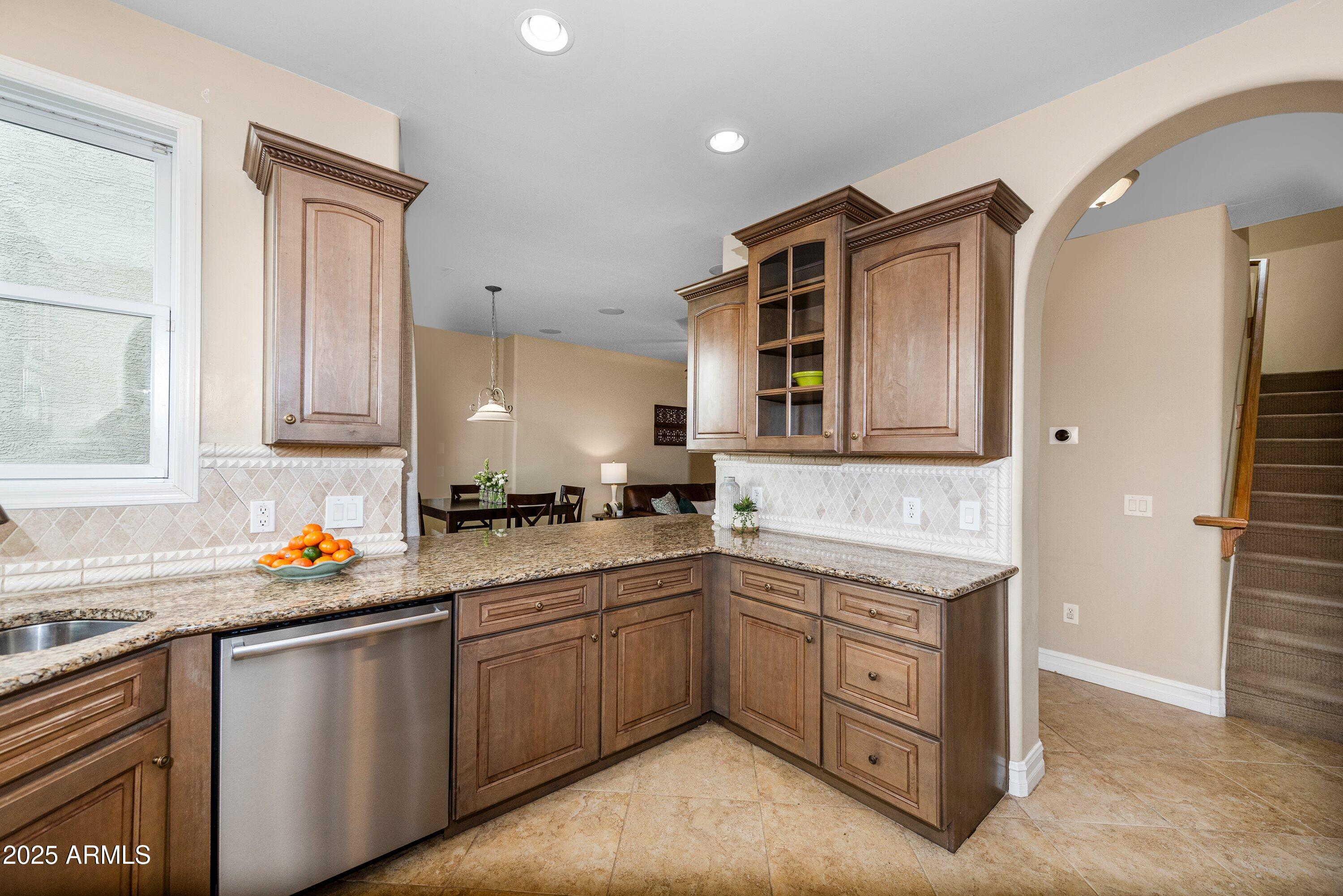 964 South Henry Lane Gilbert, AZ 85296 - Photo 13 of 48 a kitchen with a sink stove and cabinets