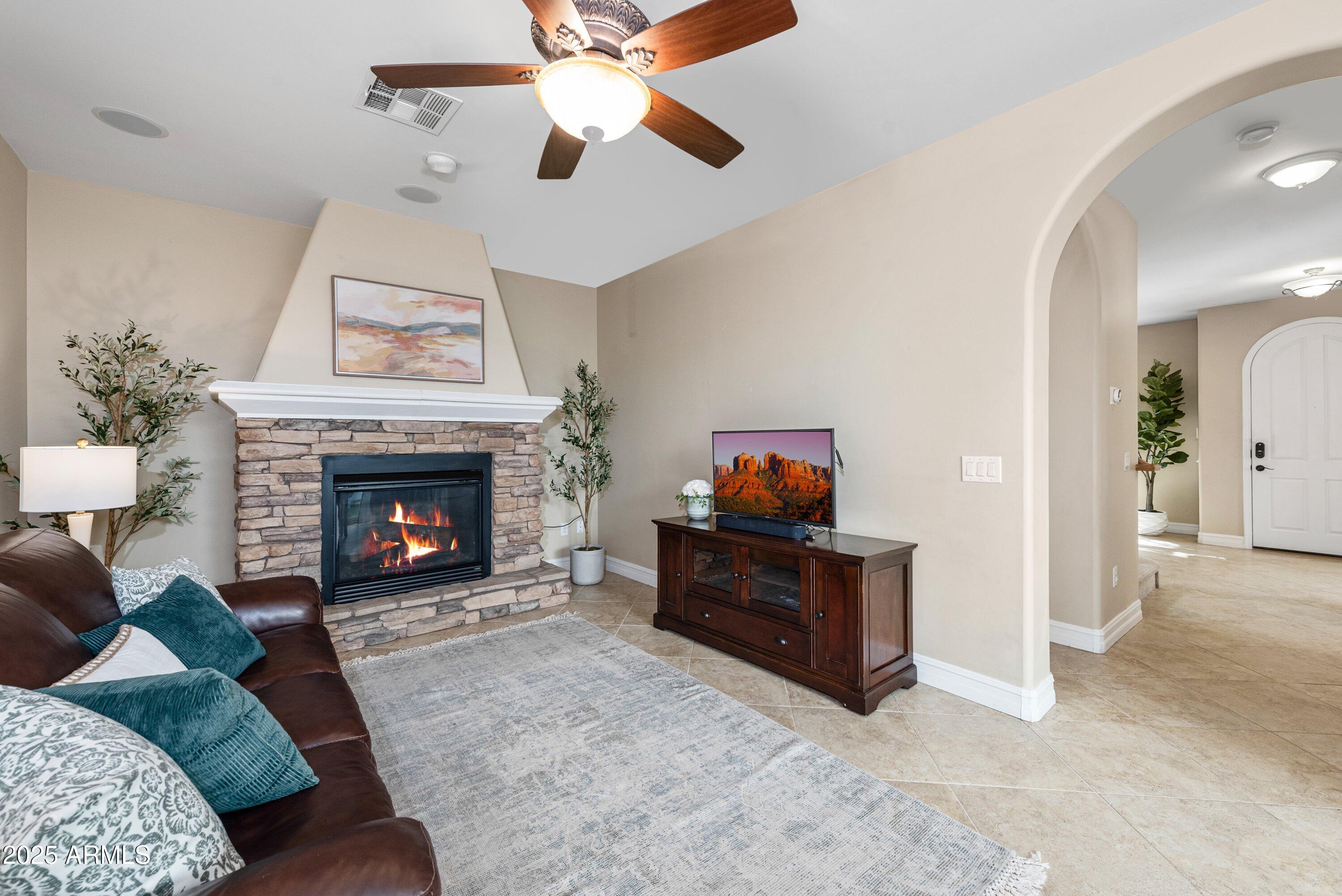 964 South Henry Lane Gilbert, AZ 85296 - Photo 17 of 48 a living room with furniture and a fireplace