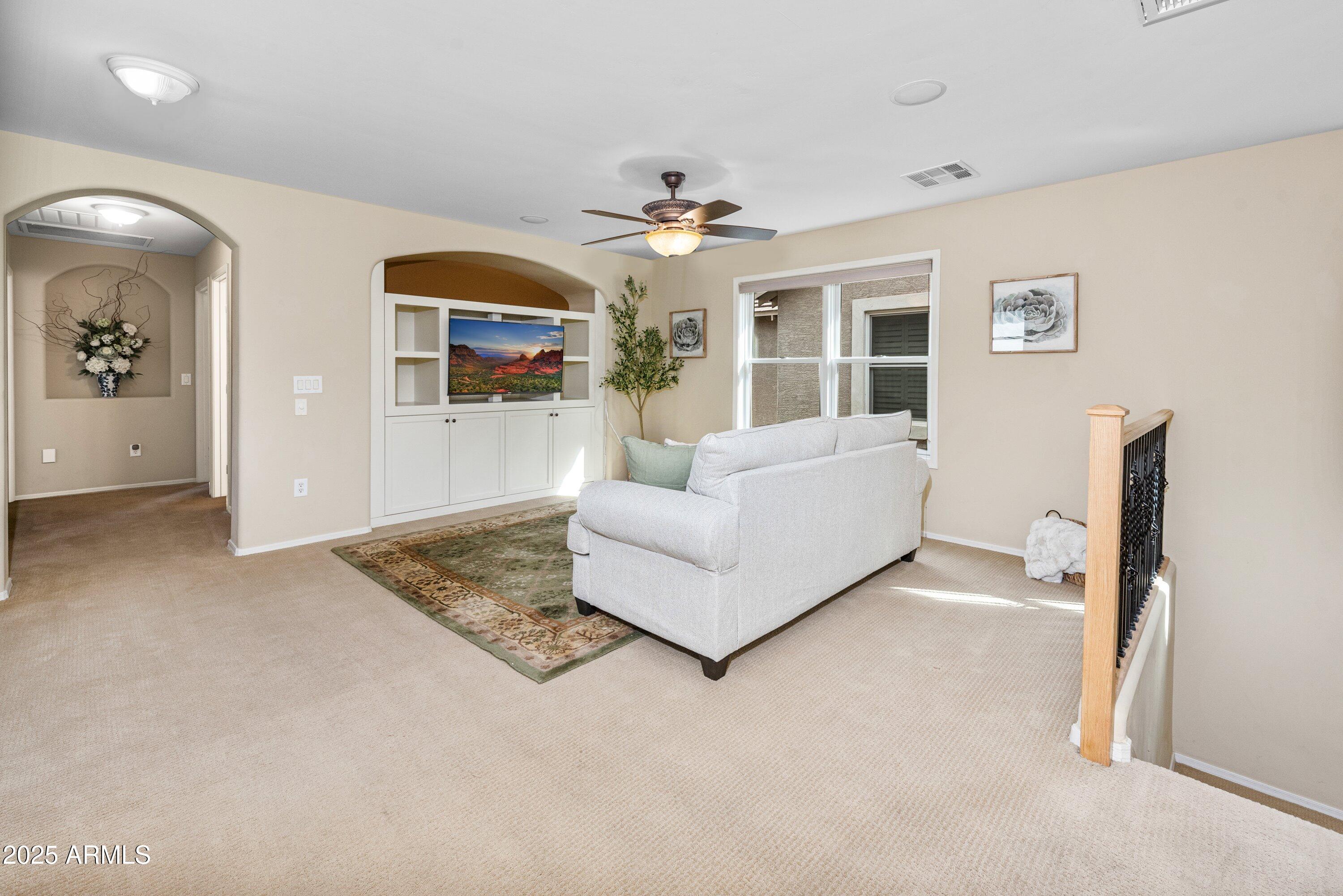 964 South Henry Lane Gilbert, AZ 85296 - Photo 19 of 48 a living room with furniture and a flat screen tv