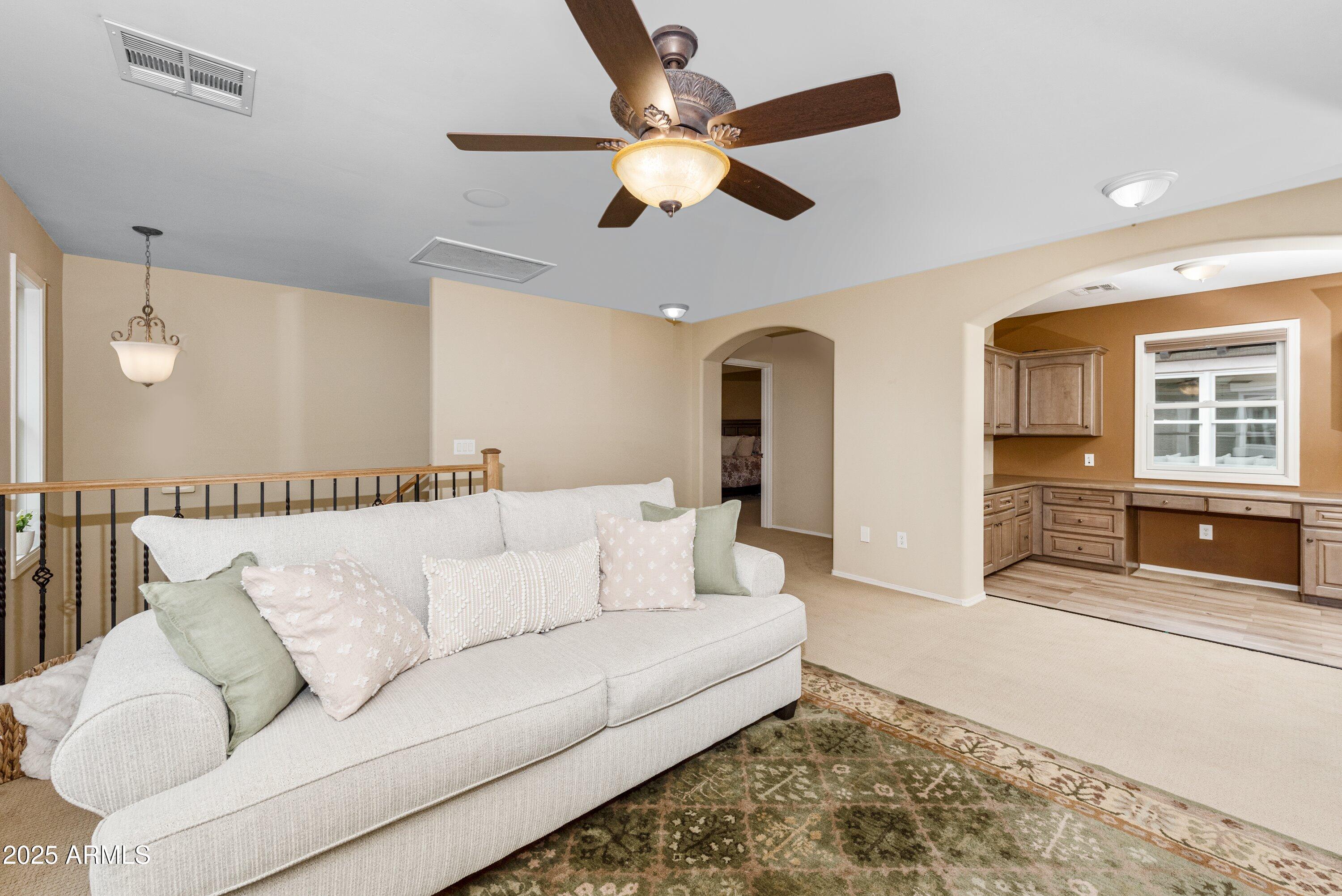 964 South Henry Lane Gilbert, AZ 85296 - Photo 20 of 48 a living room with furniture and a ceiling fan