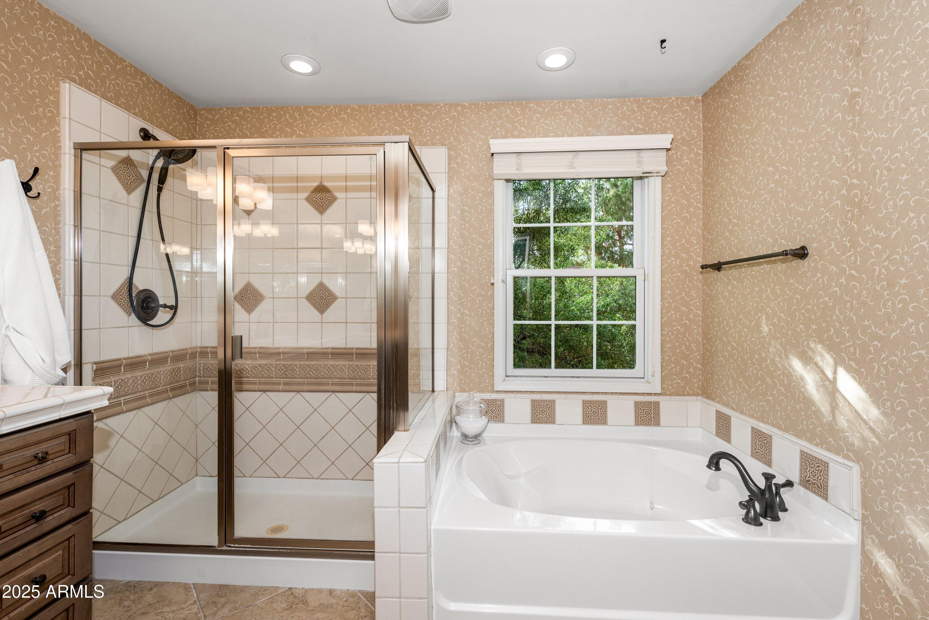 964 South Henry Lane Gilbert, AZ 85296 - Photo 26 of 48 a bathroom with a bathtub and a shower