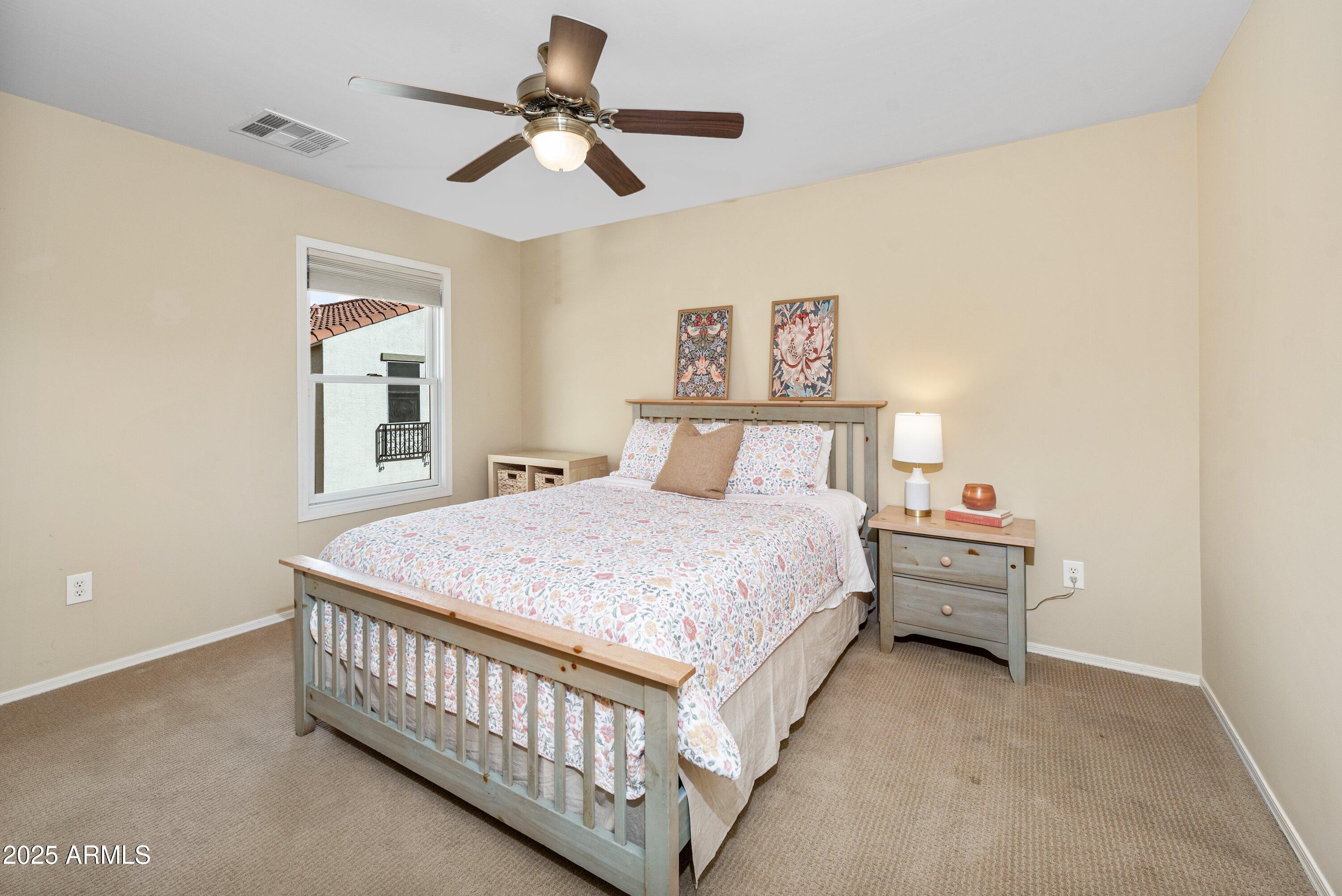 964 South Henry Lane Gilbert, AZ 85296 - Photo 29 of 48 a bedroom with a bed and a chandelier