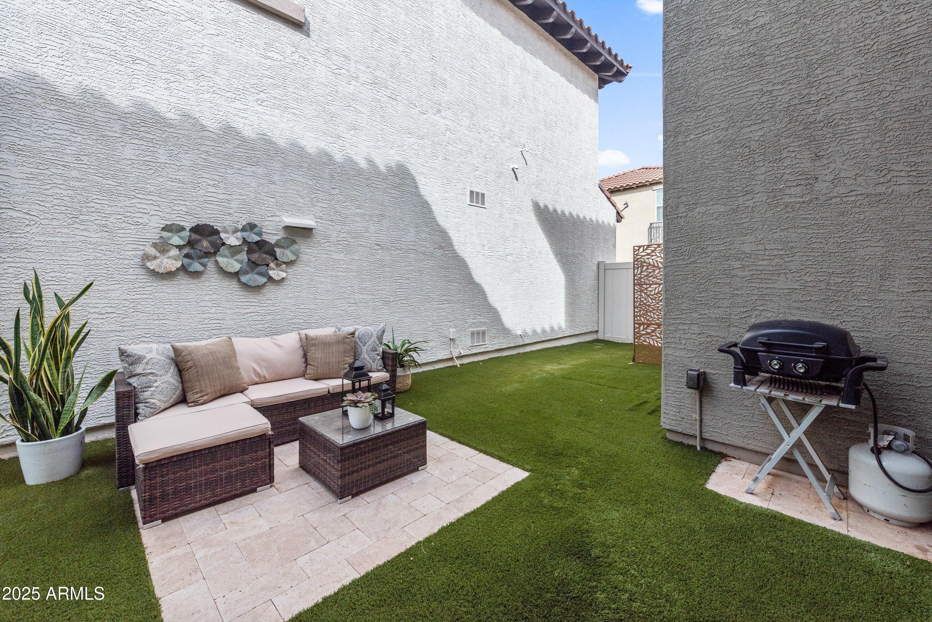 964 South Henry Lane Gilbert, AZ 85296 - Photo 31 of 48 a view of a backyard with furniture and garden