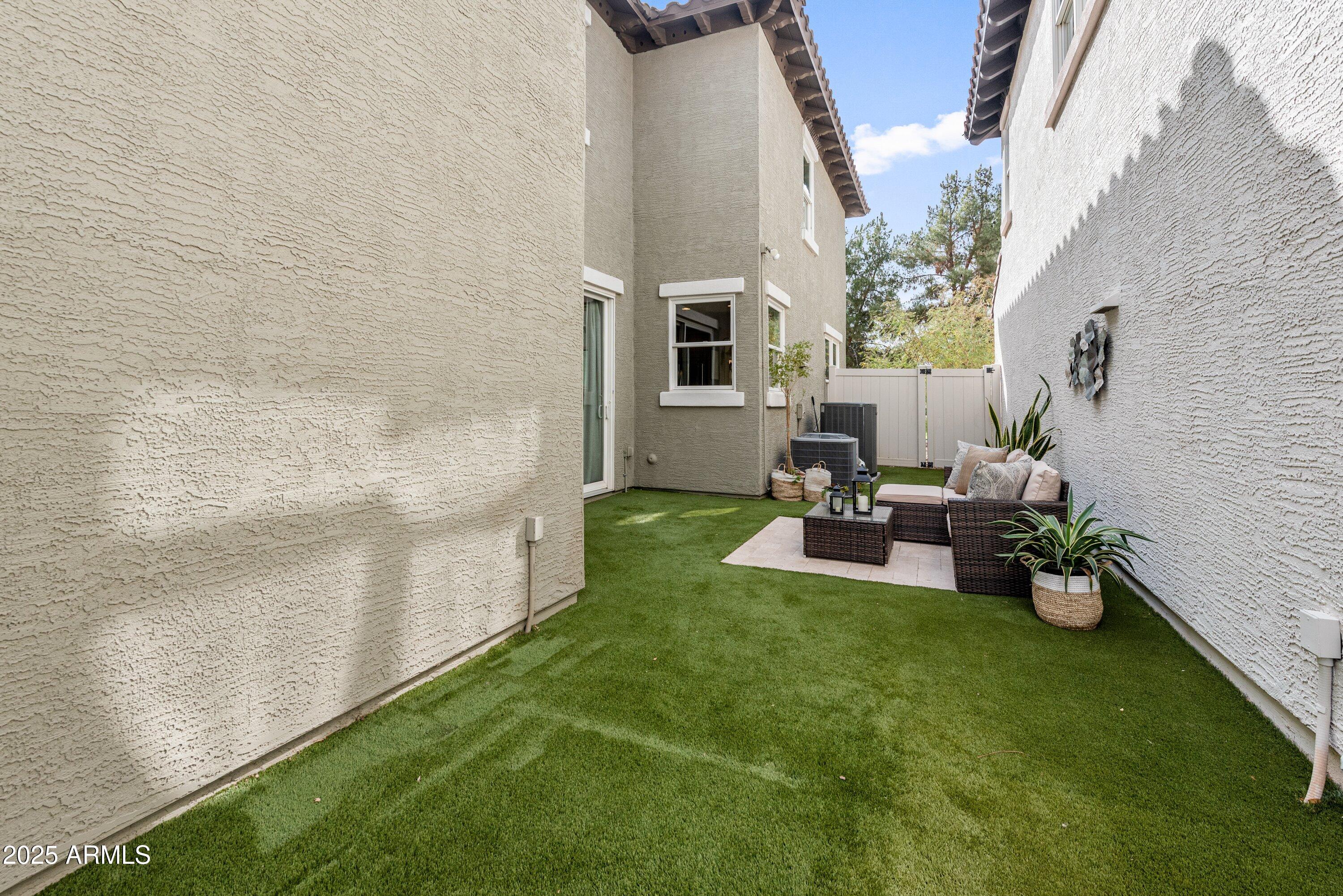 964 South Henry Lane Gilbert, AZ 85296 - Photo 32 of 48 a view of a patio with chairs and a table
