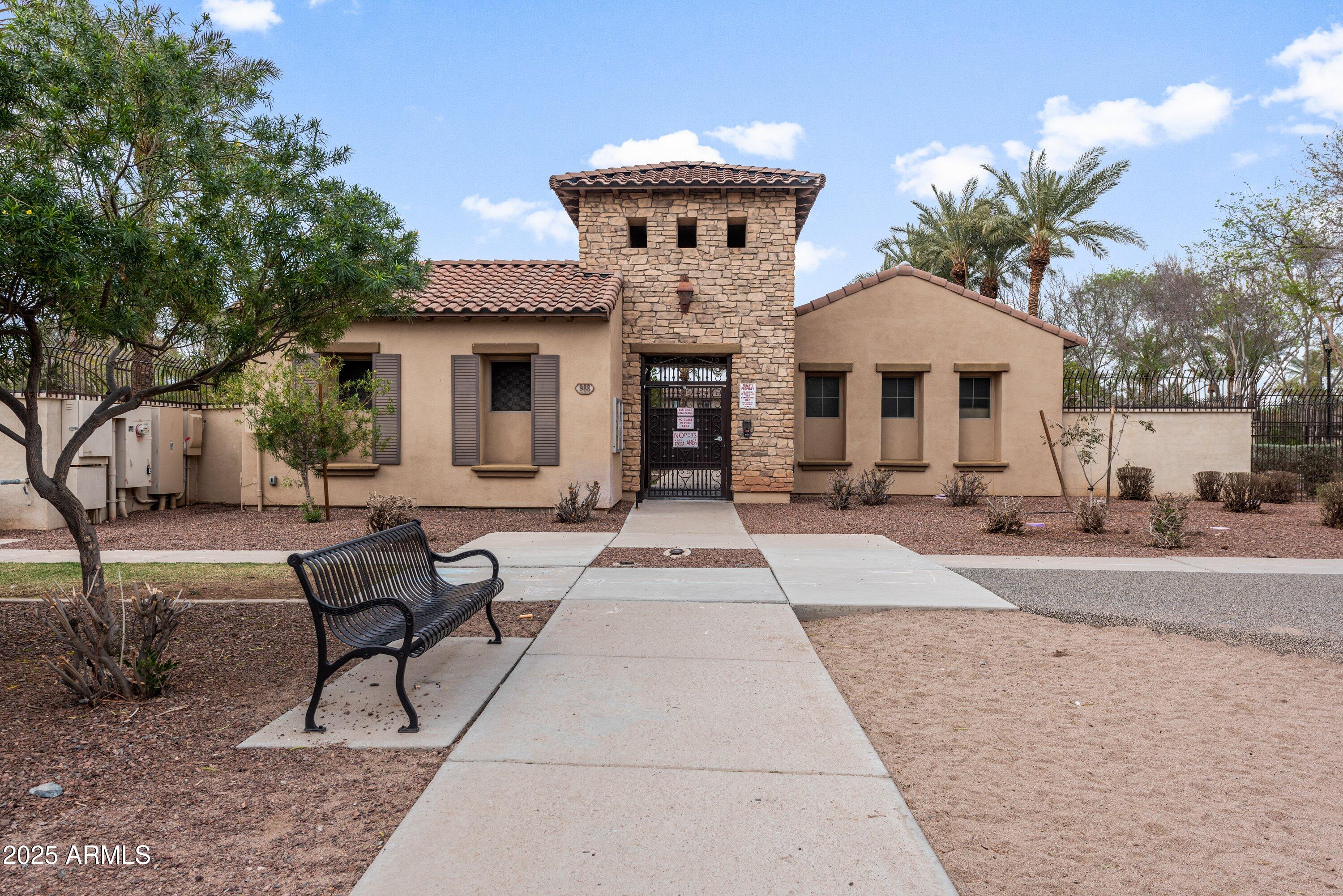964 South Henry Lane Gilbert, AZ 85296 - Photo 35 of 48 a front view of a house with yard and seating area