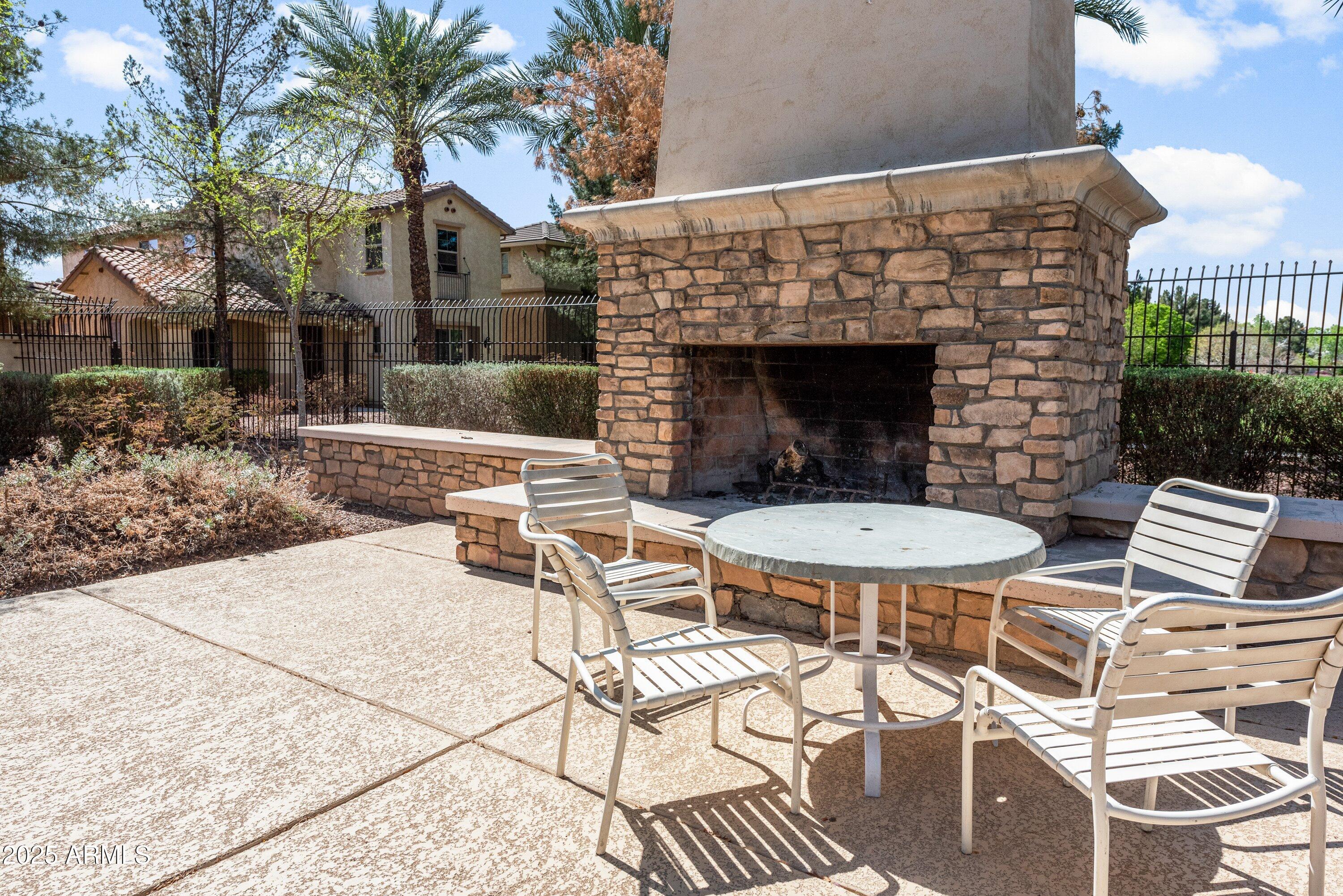 964 South Henry Lane Gilbert, AZ 85296 - Photo 40 of 48 a view of a patio with table and chairs and potted plants