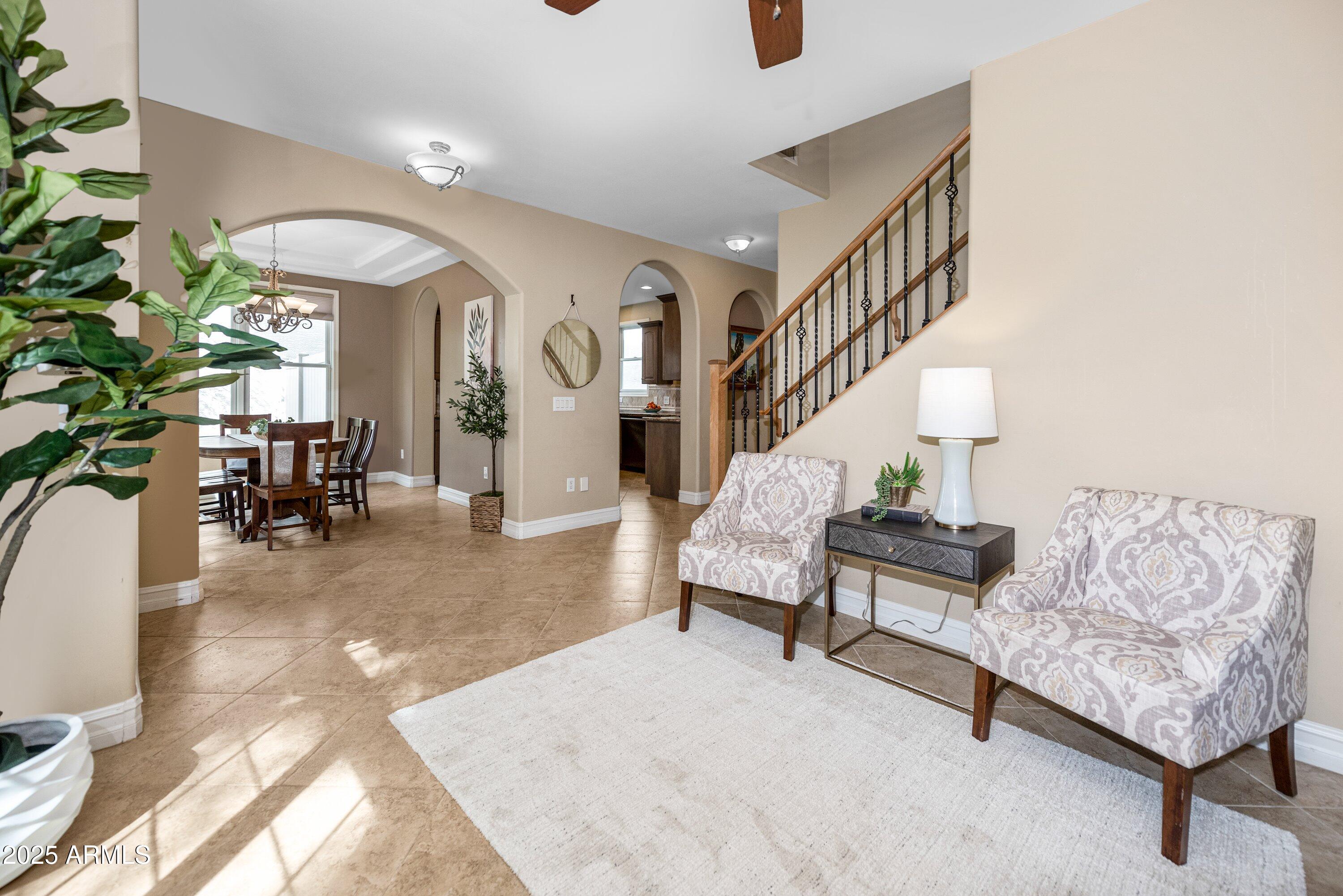 964 South Henry Lane Gilbert, AZ 85296 - Photo 10 of 48 a living room with furniture and a potted plant