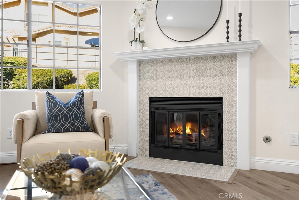 7268 Hermosa Avenue Rancho Cucamonga, CA 91701 - Photo 13 of 50 a living room with a fireplace furniture a rug and a floor to ceiling window