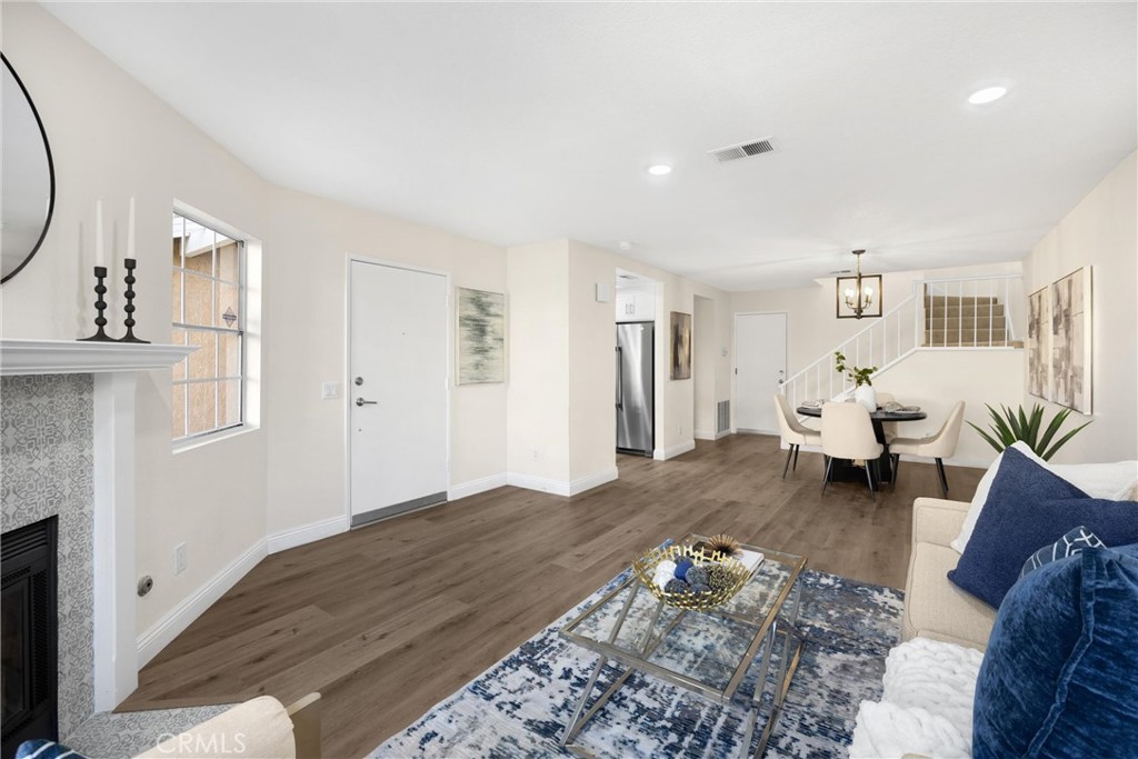 7268 Hermosa Avenue Rancho Cucamonga, CA 91701 - Photo 16 of 50 a living room with furniture and a fireplace