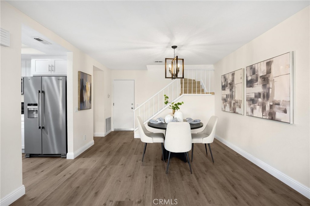 7268 Hermosa Avenue Rancho Cucamonga, CA 91701 - Photo 17 of 50 a view of a dining room with furniture and wooden floor
