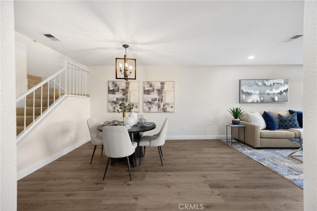 7268 Hermosa Avenue Rancho Cucamonga, CA 91701 - Photo 18 of 50 a dining room with wooden floor and a chandelier